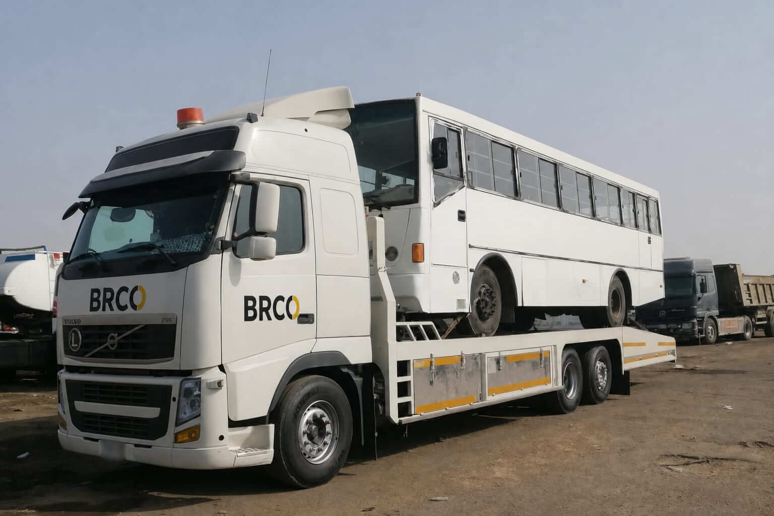 BRCO winch truck transporting a bus